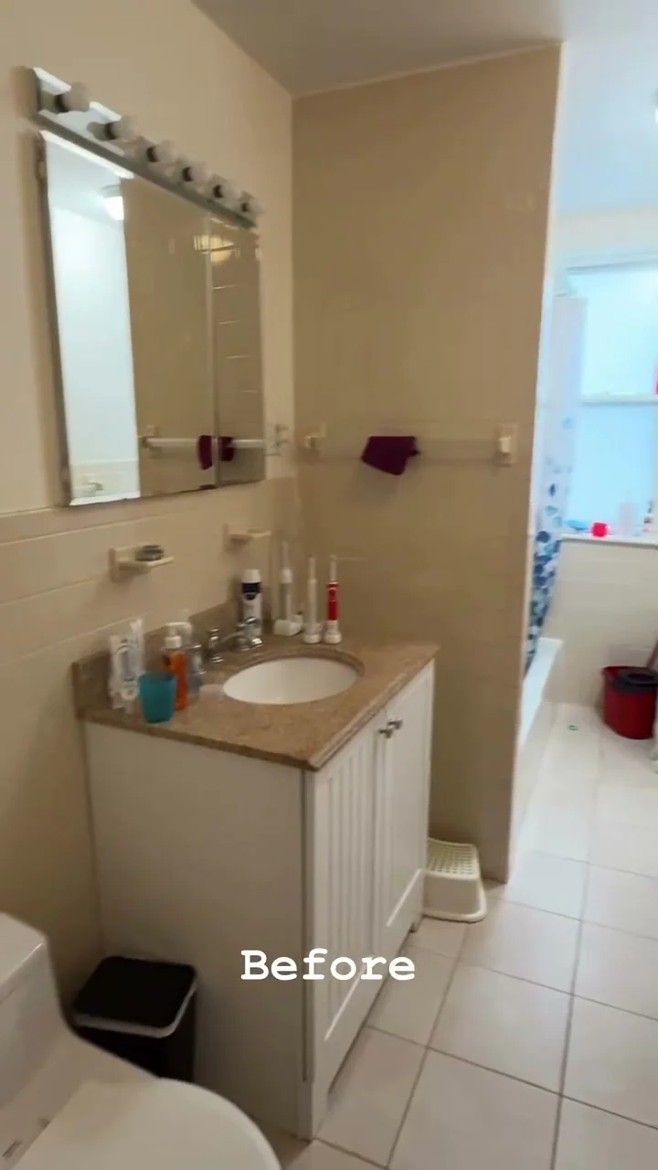 Bathroom before renovation with a small vanity and round sink
